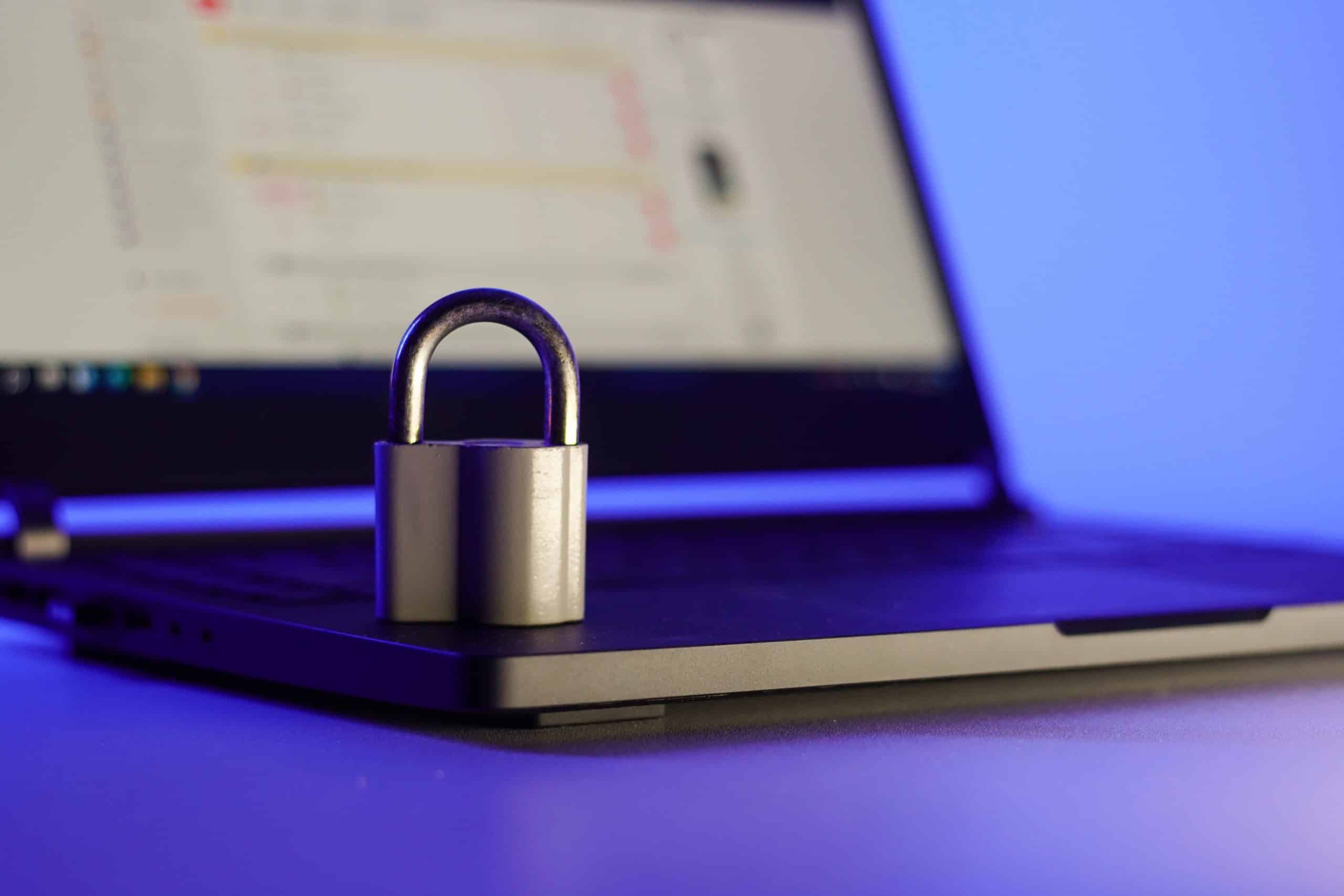 A padlock on a laptop keyboard, evoking cybersecurity and privacy.